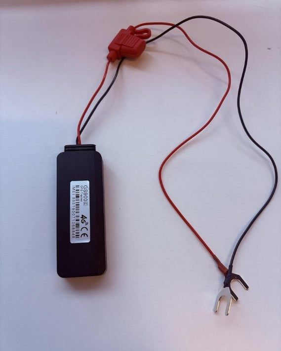 GS900 4G hardwired vehicle GPS tracker with red and black power leads, inline fuse, and fork battery terminals for easy installation.