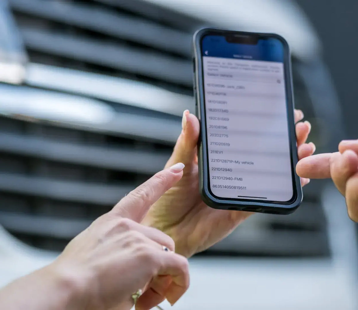 woman showing the transpoco application tracking interface on her phone